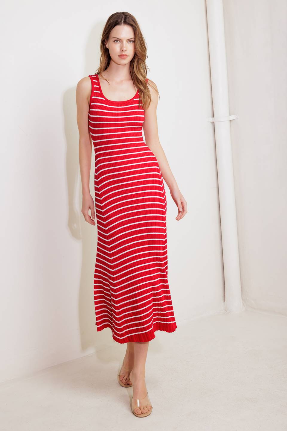A striped sweater knit midi dress featuring square neckline and sleeveless
