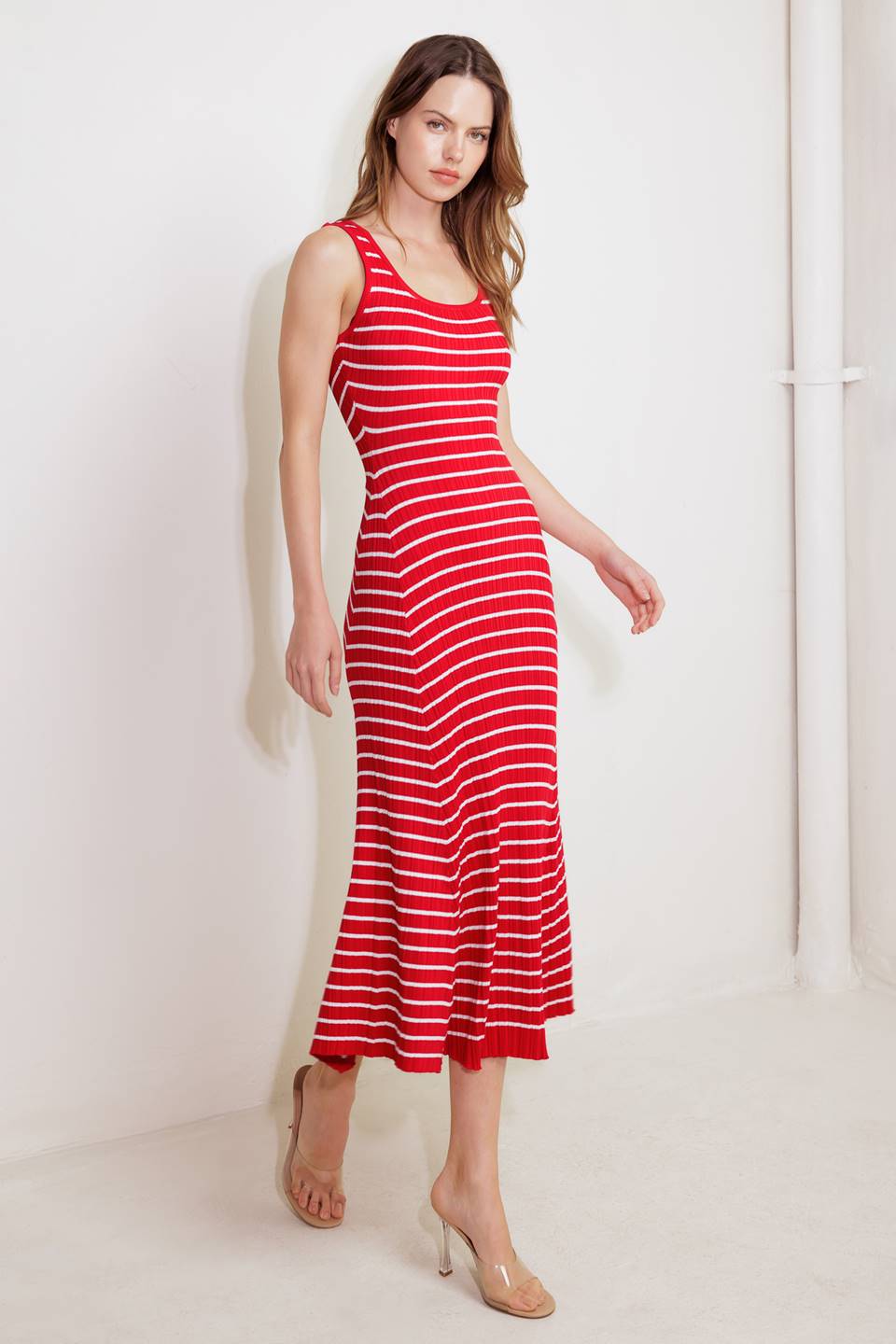 A striped sweater knit midi dress featuring square neckline and sleeveless