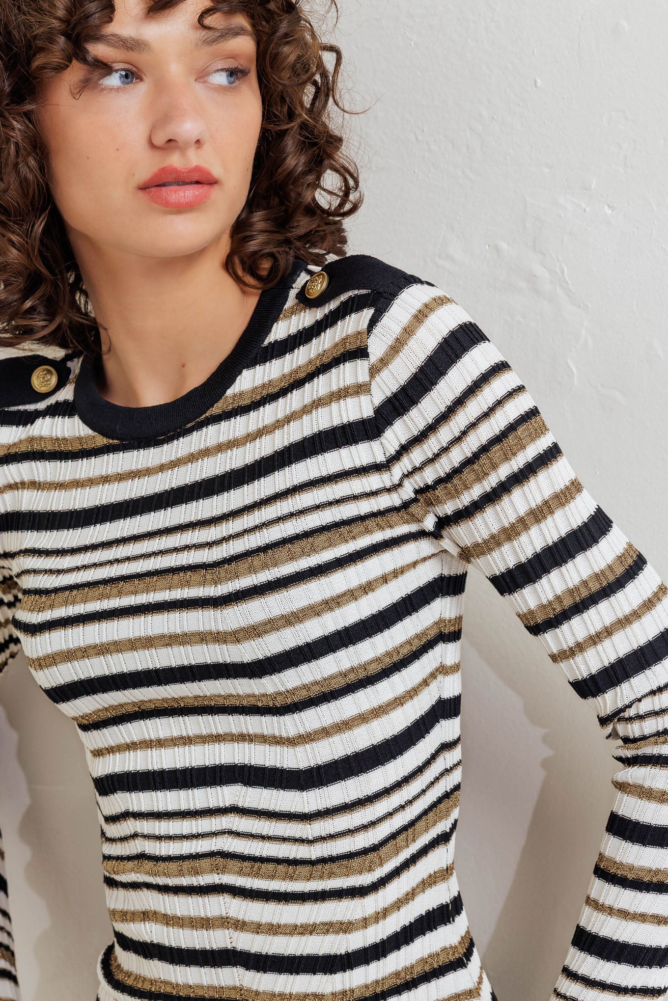 A sweater knit top with round neckline and long sleeve