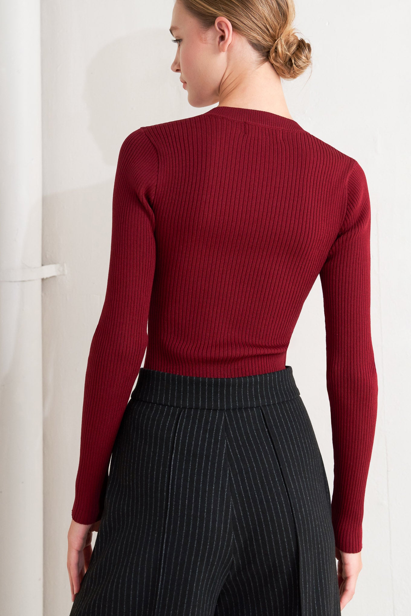 A sweater knit top with button detail