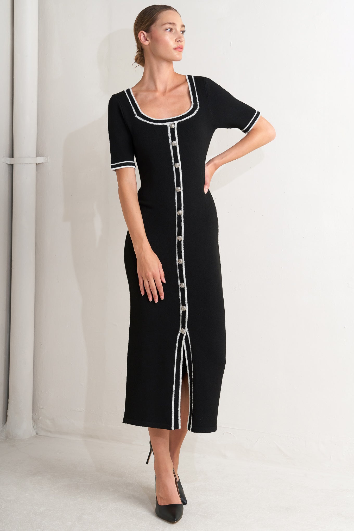 A sweater knit midi dress featuring square neckline, short sleeve and front button detail