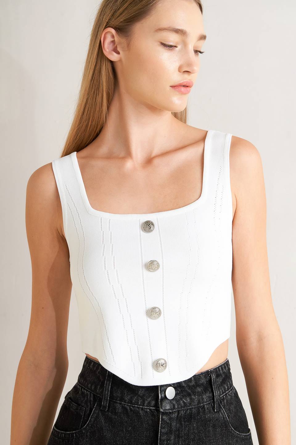 A sweater top featuring square neckline, sleeveless and button front detail