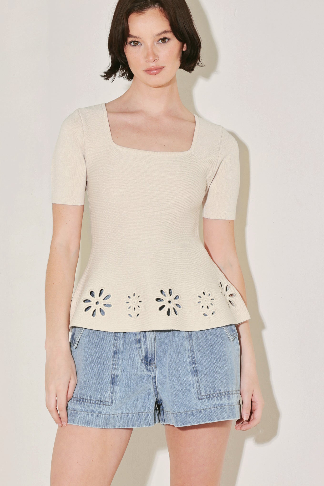 A sweater knit top featuring square neckline, short sleeve and eyelet cut out detail
Details:
Self : 60% Polyester 40% Viscose
Size & Fit
- Model is 5`8" And Wearing Size Small
- Measurements Taken From Size Small
- Approx. Length: 23"