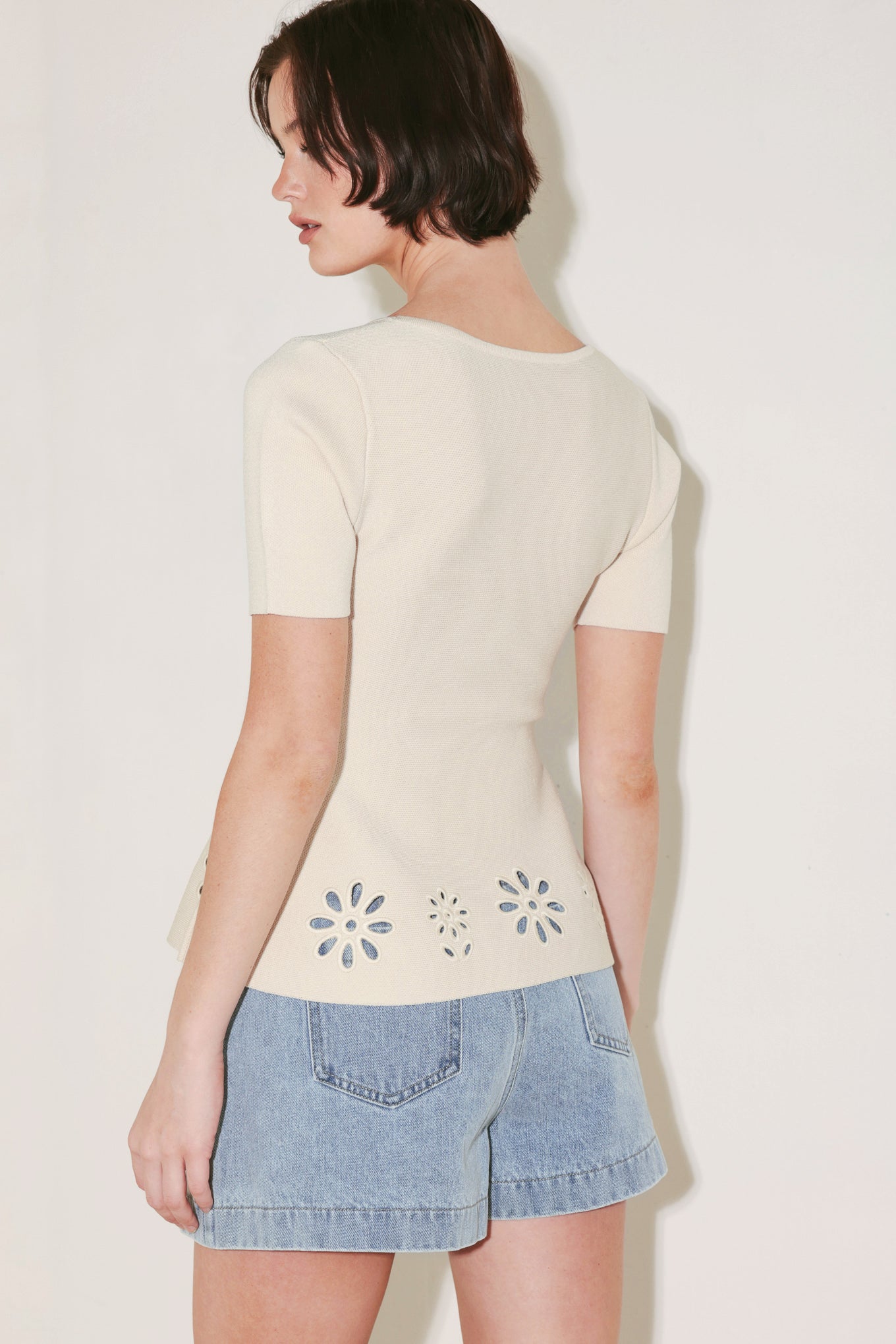 A sweater knit top featuring square neckline, short sleeve and eyelet cut out detail
Details:
Self : 60% Polyester 40% Viscose
Size & Fit
- Model is 5`8" And Wearing Size Small
- Measurements Taken From Size Small
- Approx. Length: 23"