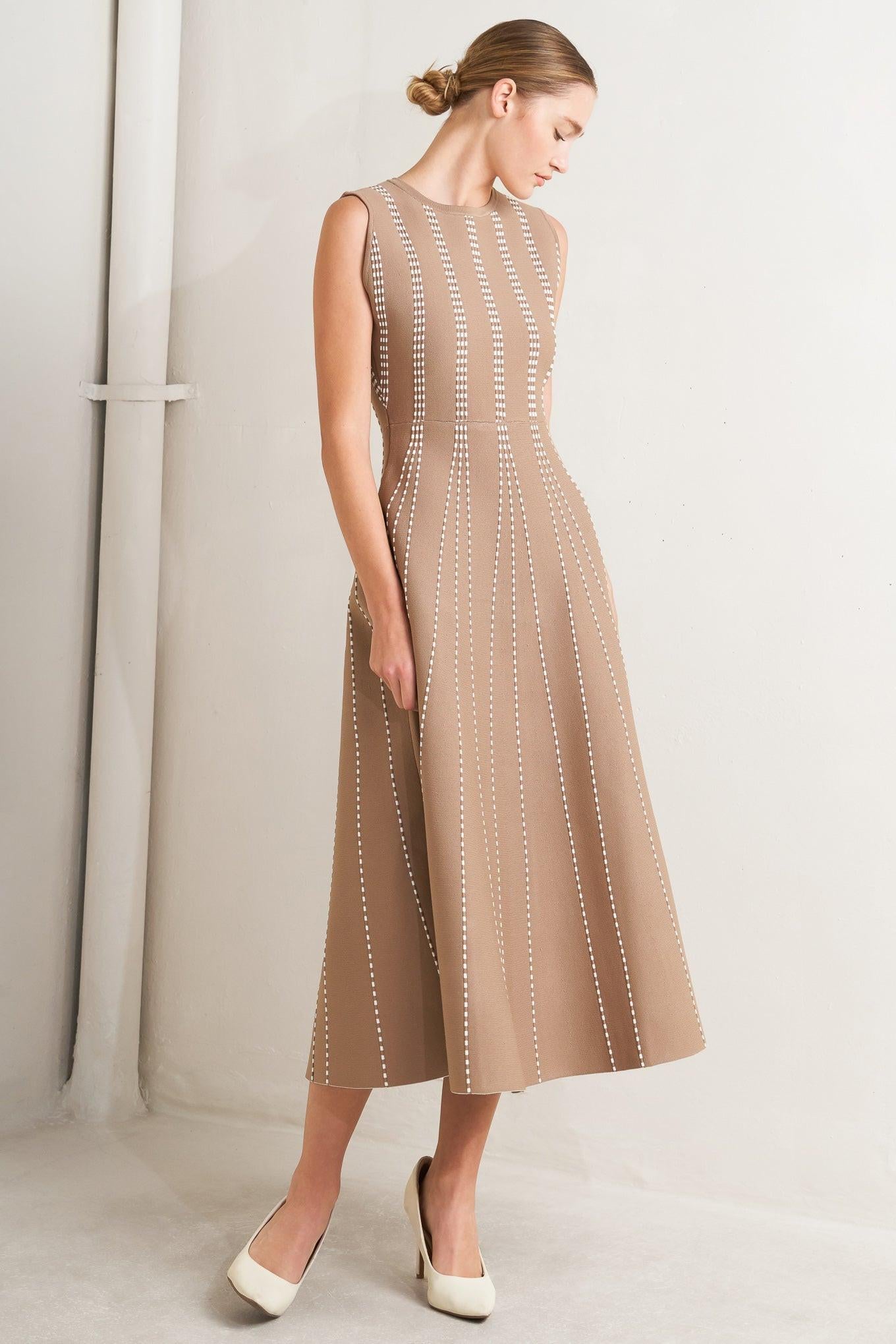 A jacquard sweater knit midi dress featuring round neckline, sleeveless and circle skirt
Details:
Self : 82% Polyester 18% Spandex
Size & Fit
- Model is 5`8" And Wearing Size Small
- Measurements Taken From Size Small
- Approx. Length: 50" Flying Tomato