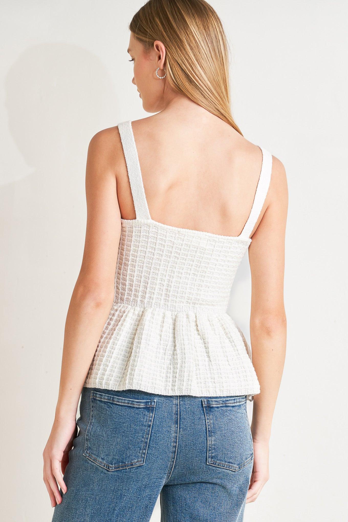 A sweater knit top featuring straight neckline, straps, jewel button down and peplum
Details:
Self : 58% Polyester 27% Acrylic 15% Nylon
Size & Fit
- Model is 5`8" And Wearing Size Small
- Measurements Taken From Size Small
- Approx. Length: 23"