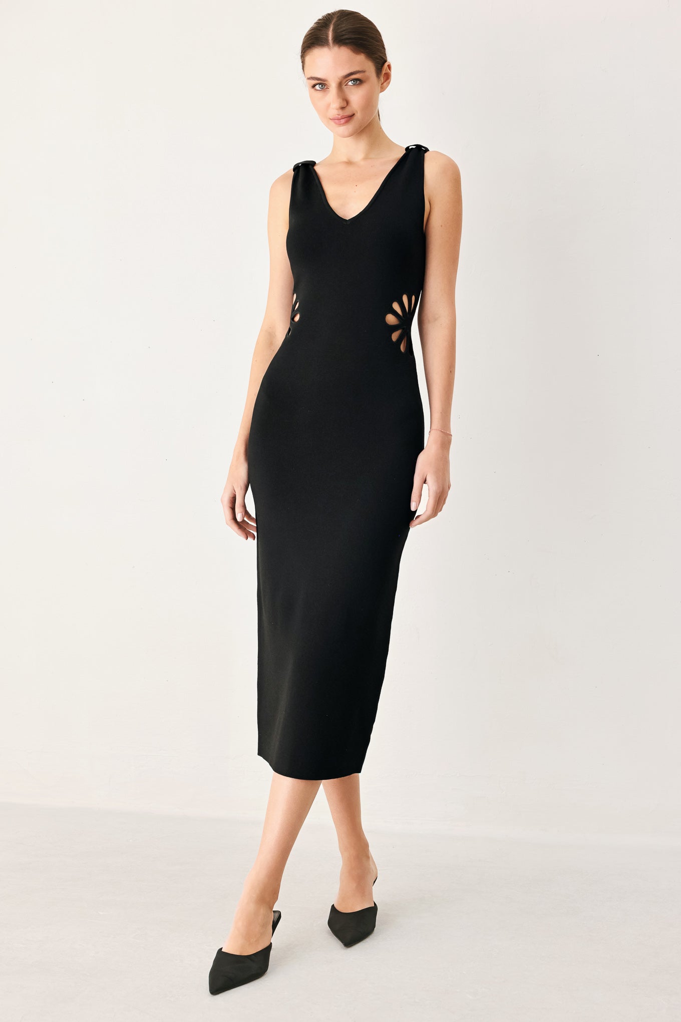 A sweater knit midi dress featuring V neckline and side cut out