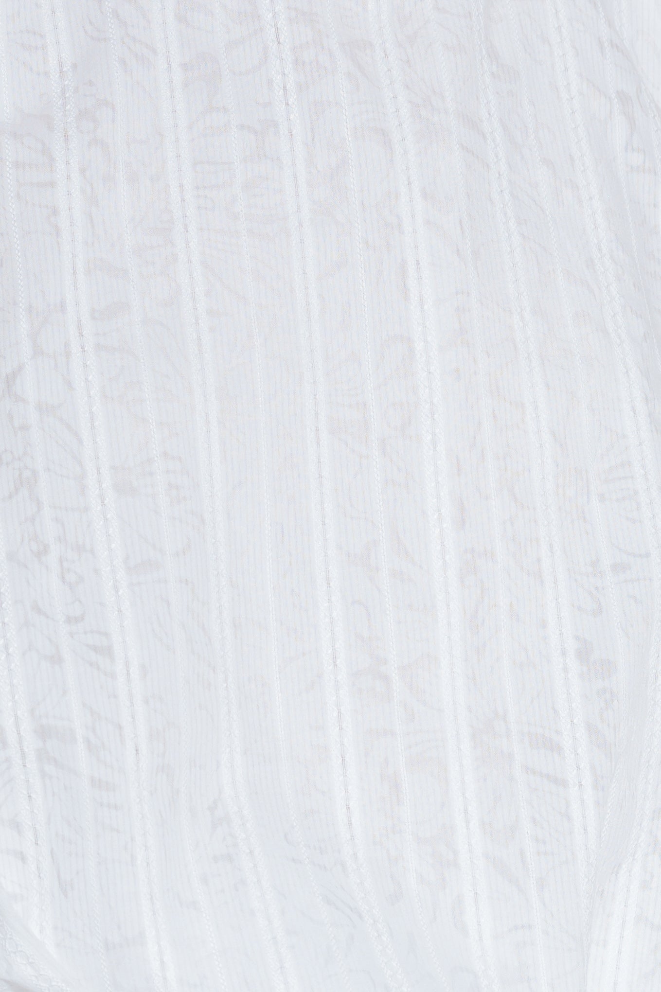 A woven lace top featuring round neckline, sleeveless and bubble hemline.