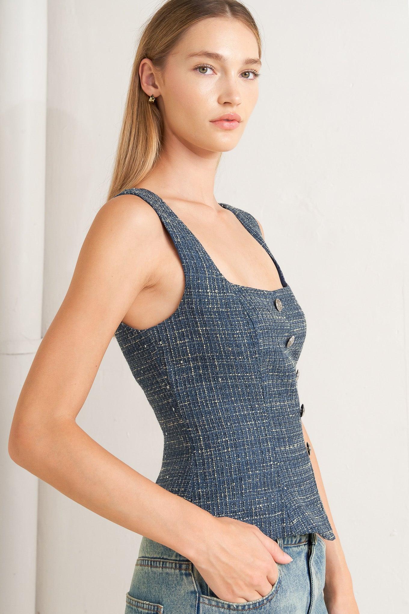 A tweed top featuring square neckline, sleeveless, button down detail and back zipper closure