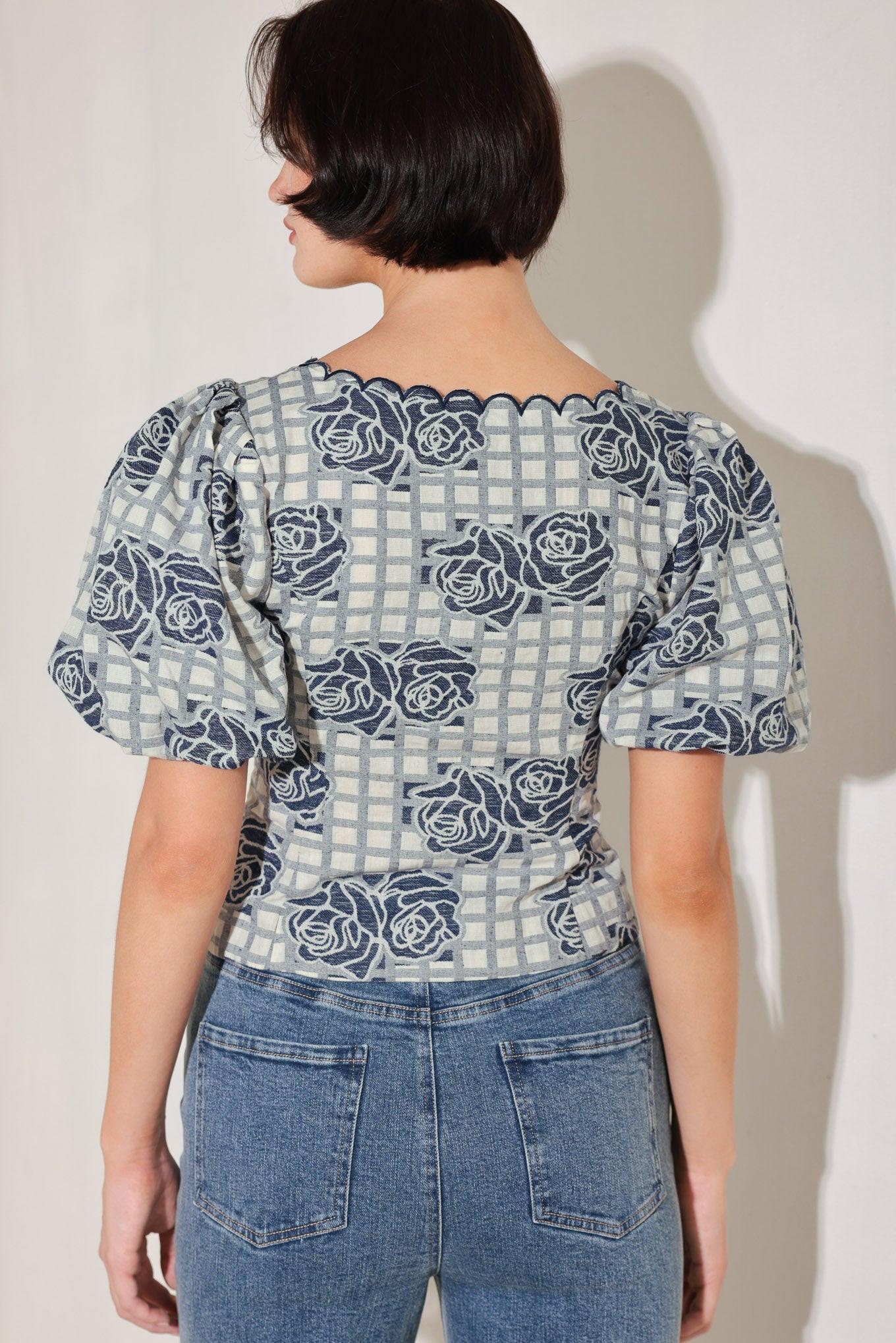 A woven jacquard top featuring square neckline with scallop edge, short puff sleeve and button down.
Details:
Self : 60% Cotton 40% Polyester
Size & Fit
- Model is 5`8" And Wearing Size Small
- Measurements Taken From Size Small
- Approx. Length: 19"