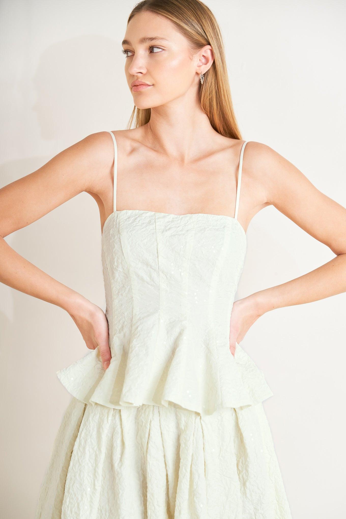 A textured woven top featuring straight neckline, straps, peplum and back zipper closure. Matching skirt FK1250T
Details:
Self : 100% Polyester
Size & Fit
- Model is 5`8" And Wearing Size Small
- Measurements Taken From Size Small
- Approx. Length: 21"