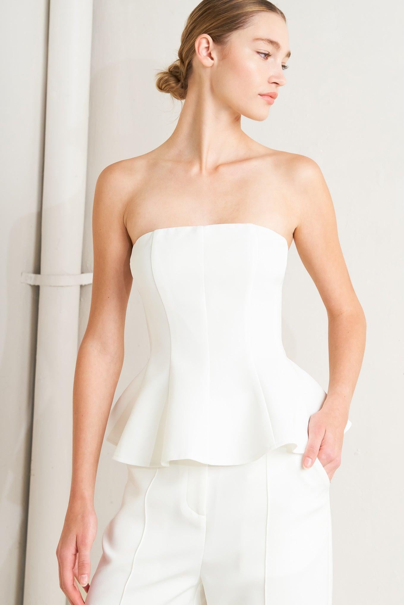 A solid woven top featuring strapless, peplum and back zipper closure.
Matching pants FP1928T
Details:
Self : 96% Polyester 4% Spandex
Size & Fit
- Model is 5`8" And Wearing Size Small
- Measurements Taken From Size Small
- Approx. Length: 16" Flying Tomato