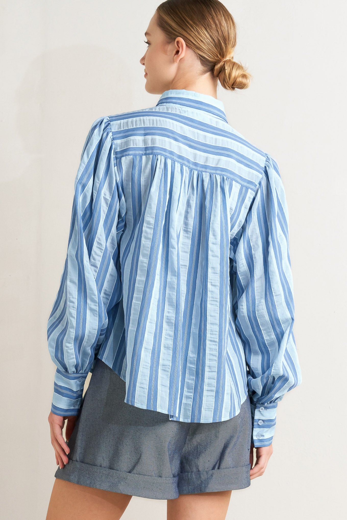 Blue striped long-sleeve button-front blouse
Details:
Self: 40% Tencel 38% Polyester 20% Nylon 2% Lurex
Size & Fit
- Model is 5`8" And Wearing Size Small
- Measurements Taken From Size Small
- Approx. Length: 27"