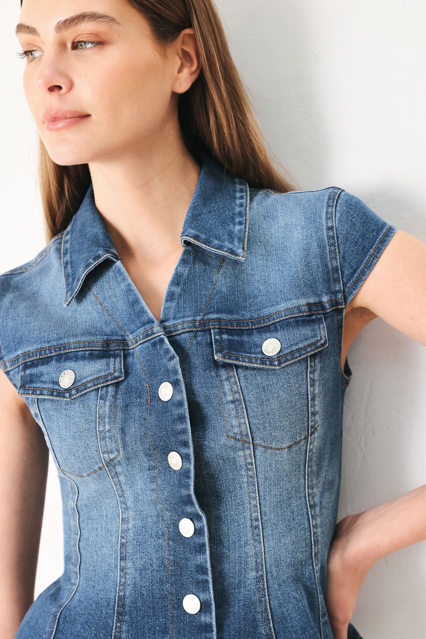 Woman wearing a denim top with collar, cap sleeve and front button down | FREEMARKET | Flying Tomato