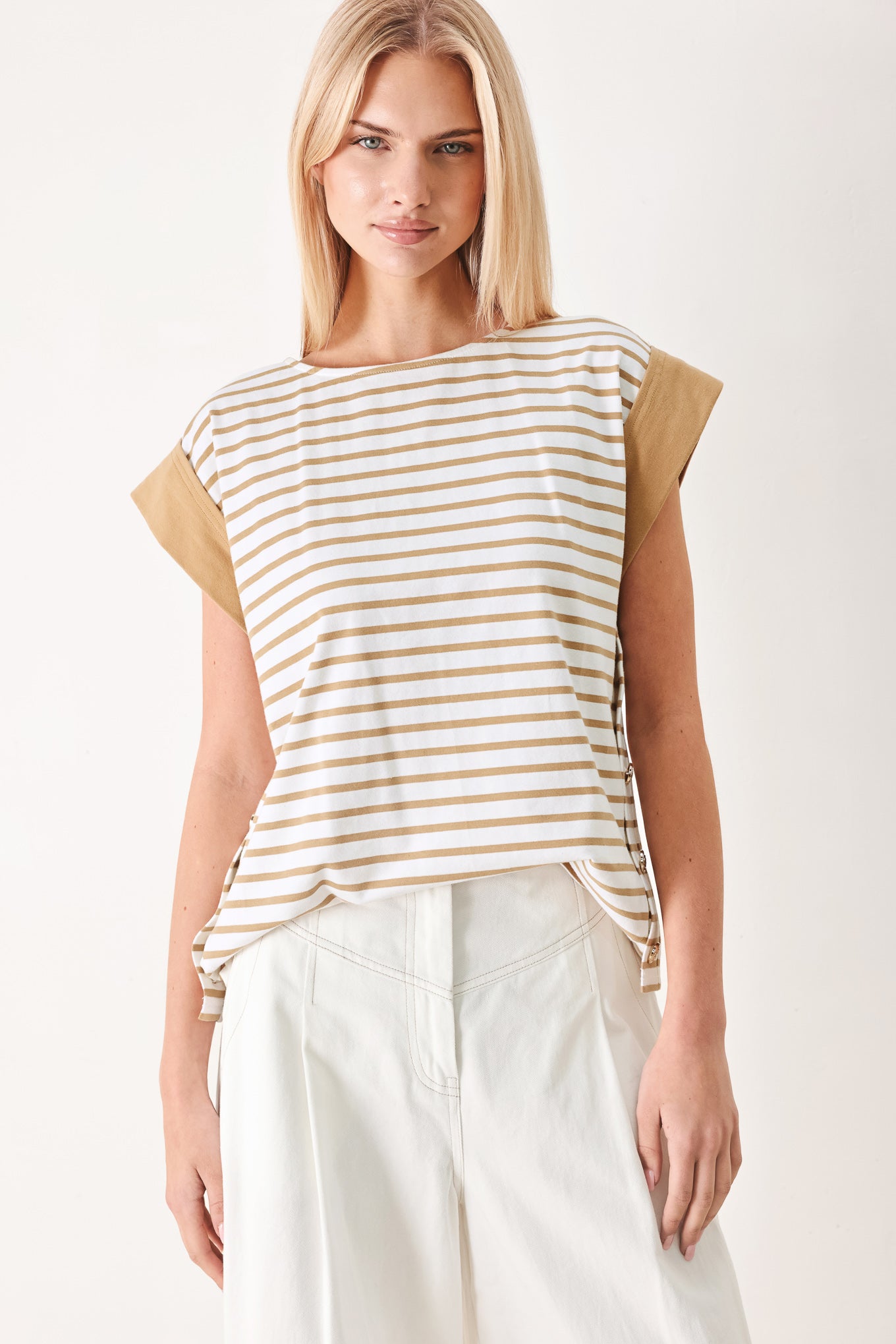 Woman wearing a striped knit top with wide neckline, short sleeve and side button | FREEMARKET