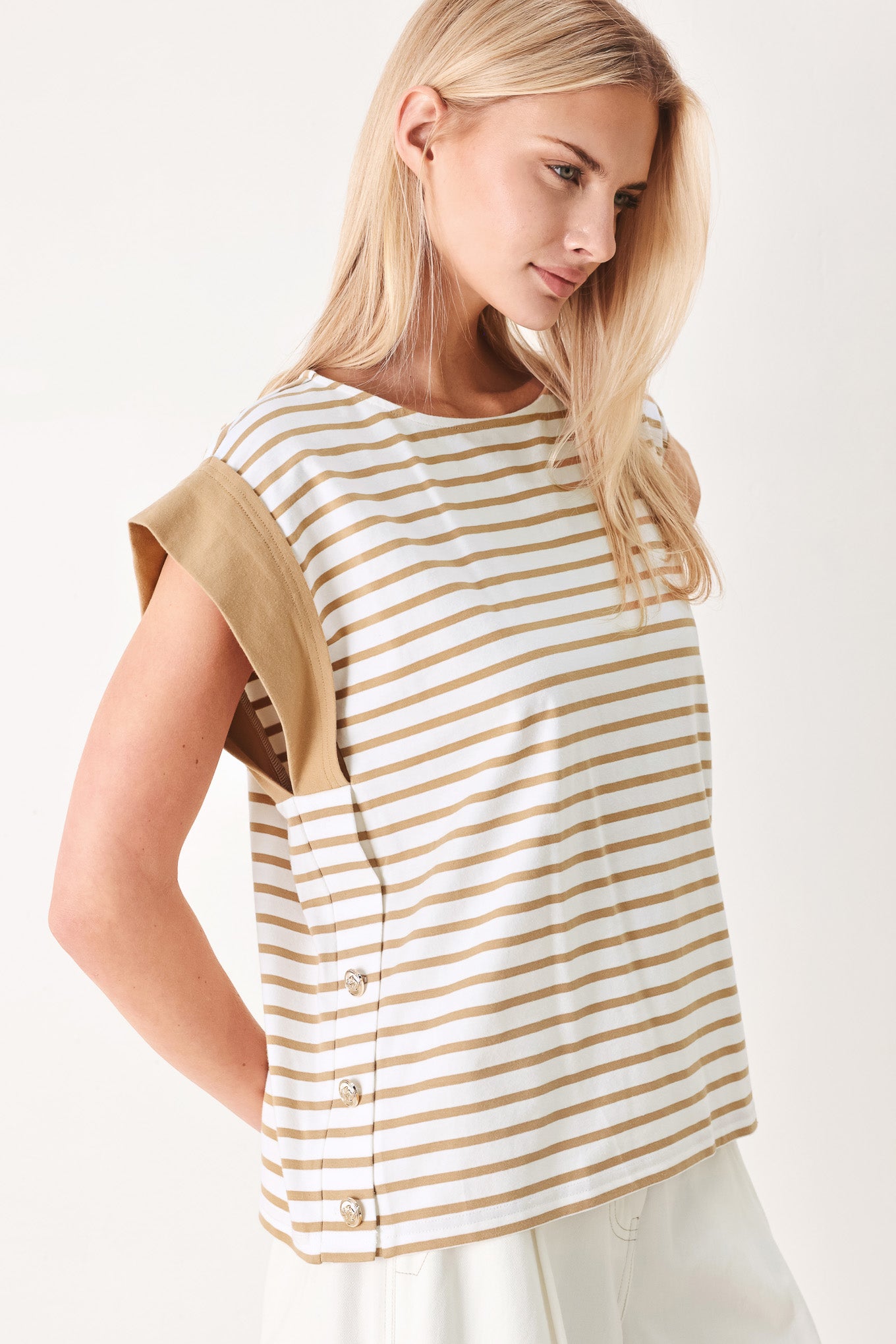 Woman wearing a striped knit top with wide neckline, short sleeve and side button | FREEMARKET