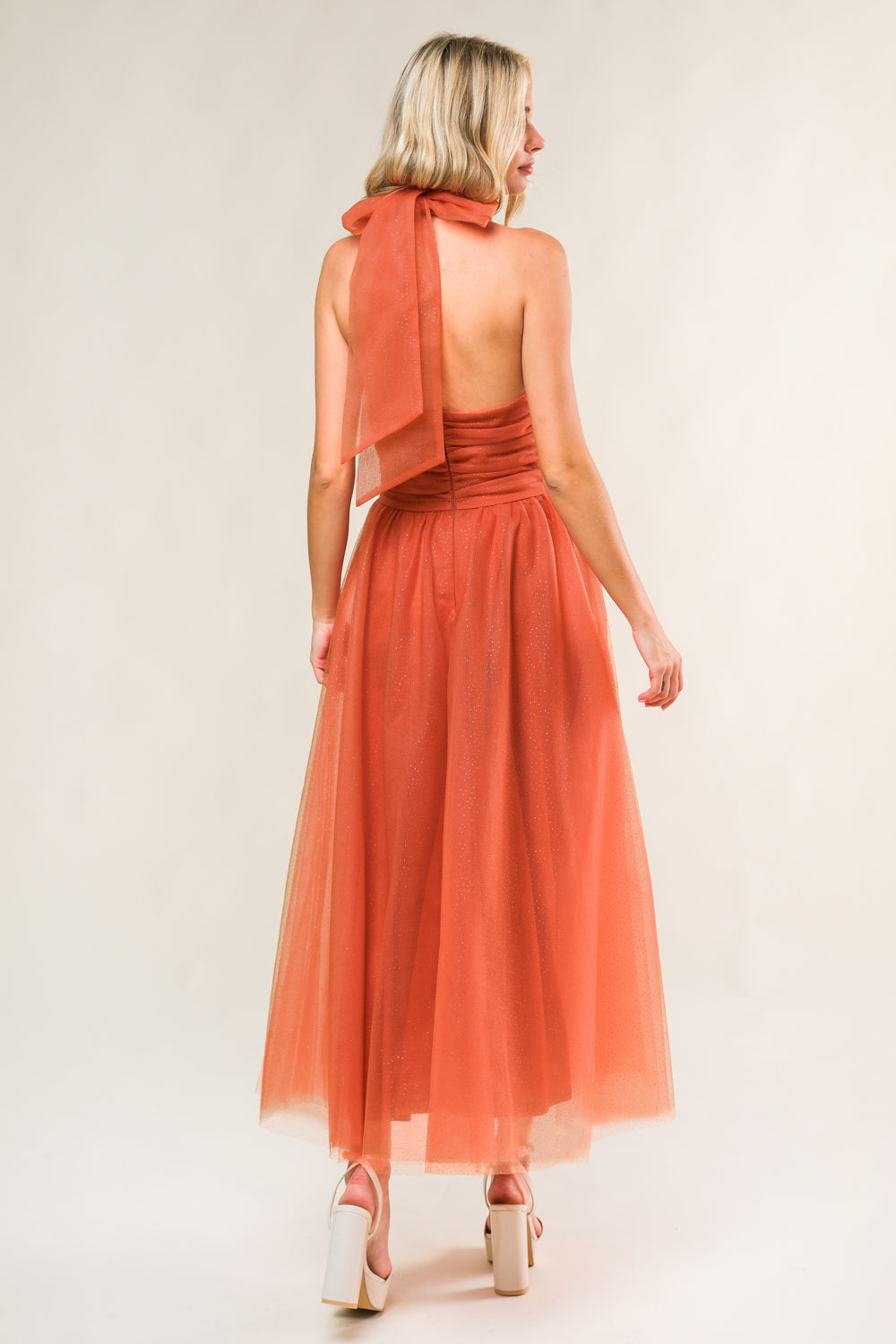 A embellished mesh midi dress featuring halter neckline with back neck tie, waist yoke, full skirt and bare back with zipper closure
Details:
Self : 100% Nylon
Contrast: 100% Polyester
Lining: 100% Polyester
Size & Fit
- Model is 5`7" And Wearing Size Small
- Measurements Taken From Size Small
- Approx. Length: 51"