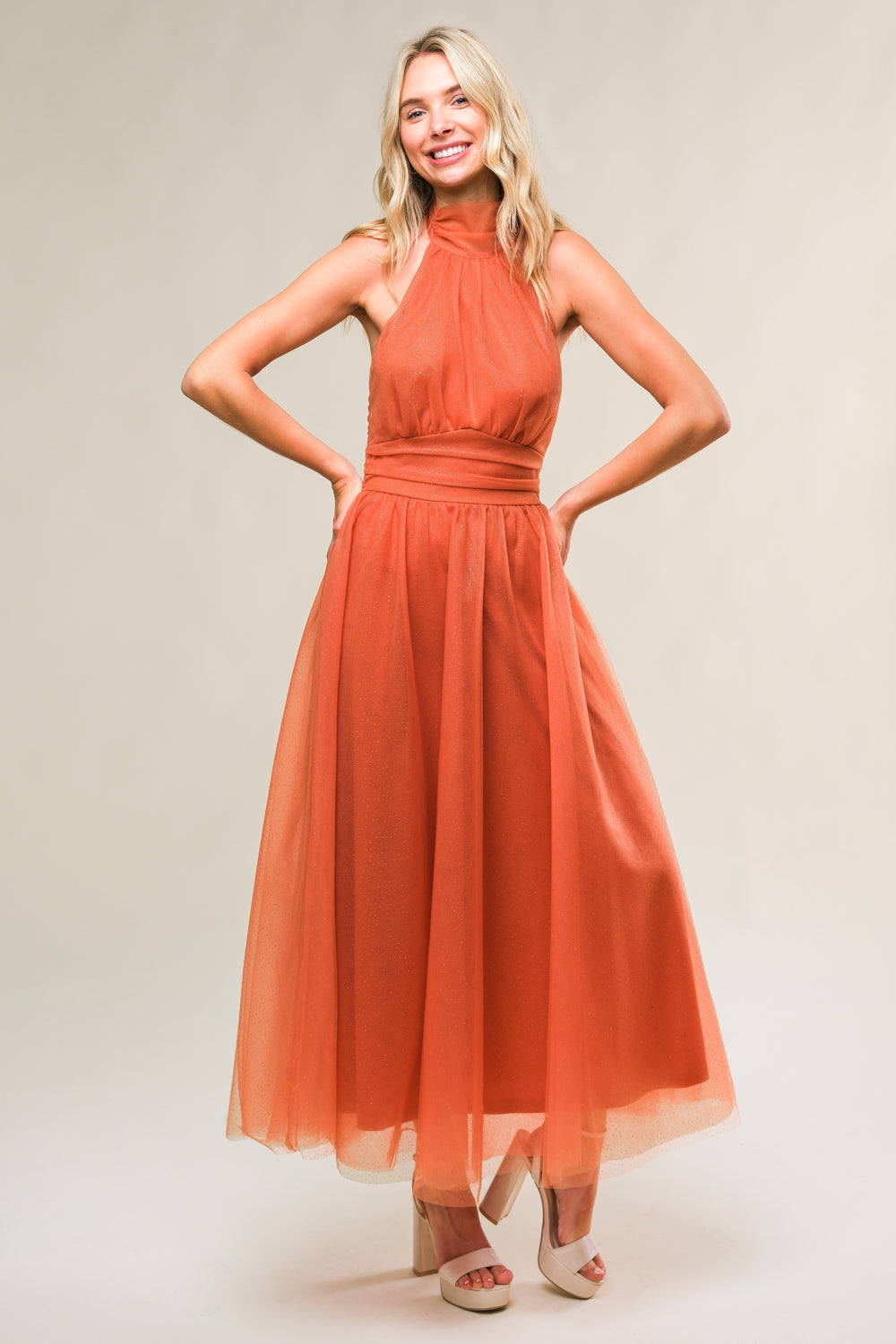 A embellished mesh midi dress featuring halter neckline with back neck tie, waist yoke, full skirt and bare back with zipper closure
Details:
Self : 100% Nylon
Contrast: 100% Polyester
Lining: 100% Polyester
Size & Fit
- Model is 5`7" And Wearing Size Small
- Measurements Taken From Size Small
- Approx. Length: 51"