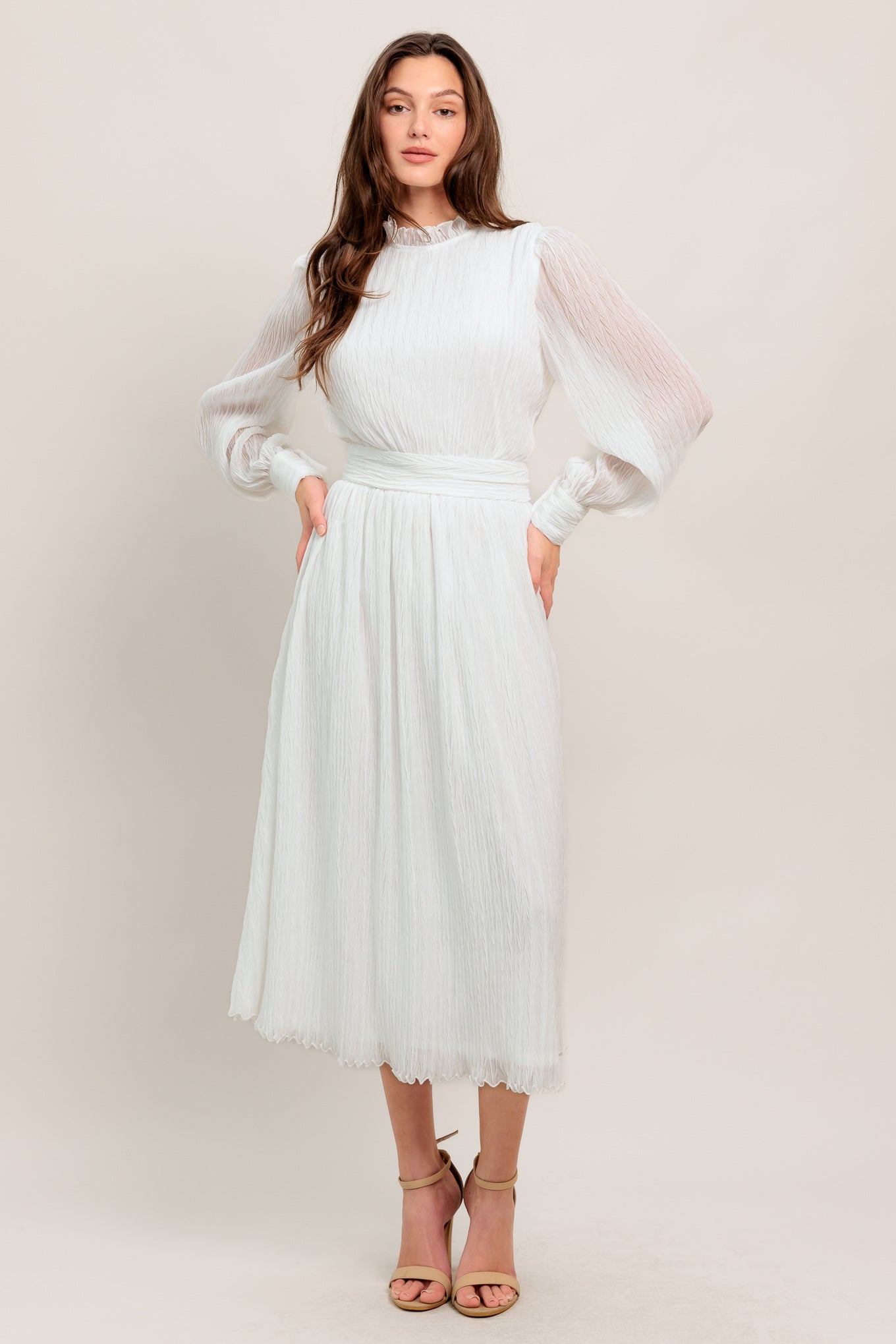 A textured woven midi dress featuring high neckline with ruffled edge, long sleeve with cuff, full skirt and back zipper closure
Details:
Self : 100% Polyester
Lining: 100% Polyester
Size & Fit
- Model is 5`7" And Wearing Size Small
- Measurements Taken From Size Small
- Approx. Length: 48"