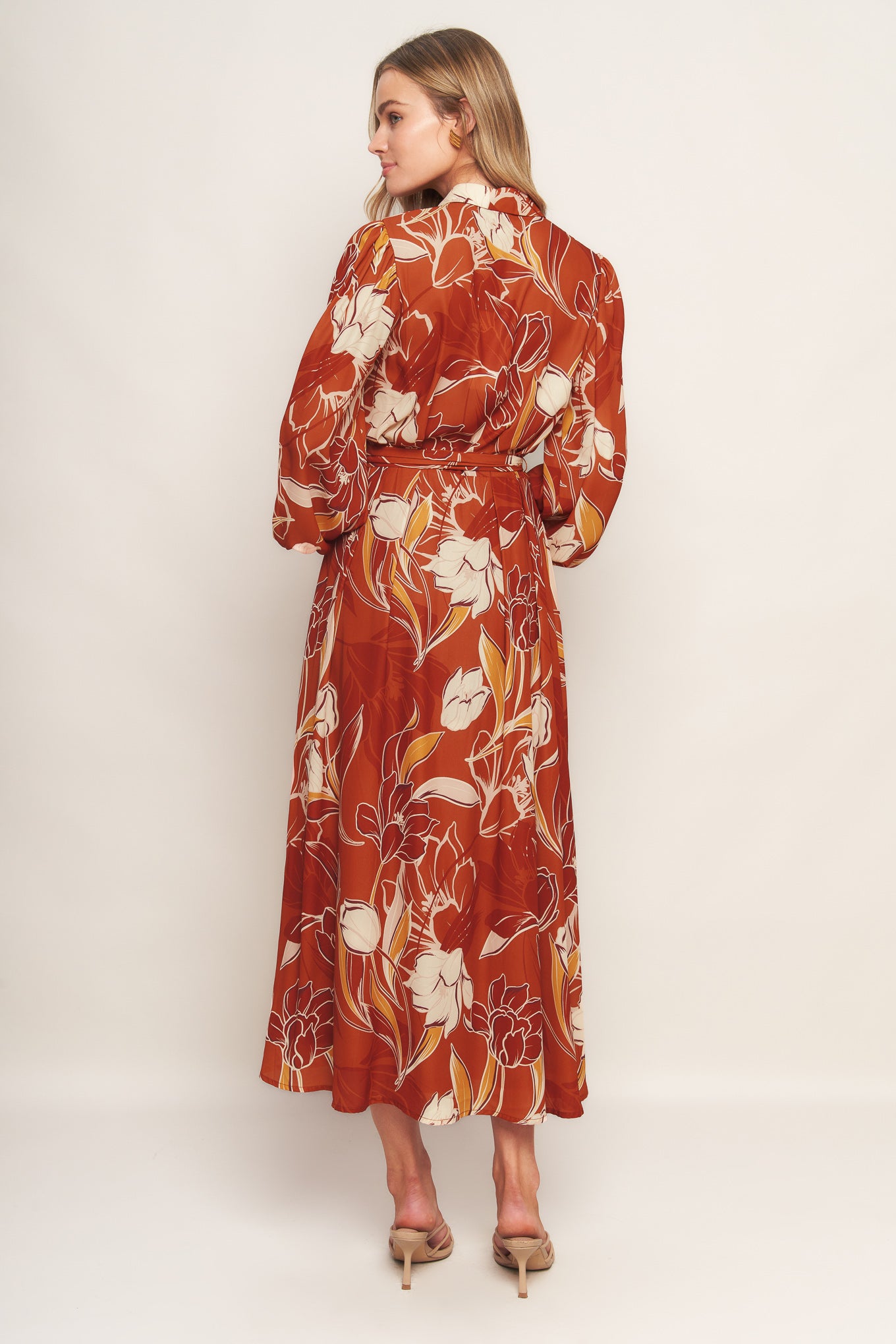 A printed woven midi dress featuring shirt collar, V neckline, long sleeves, button down, self sash tie and full skirt