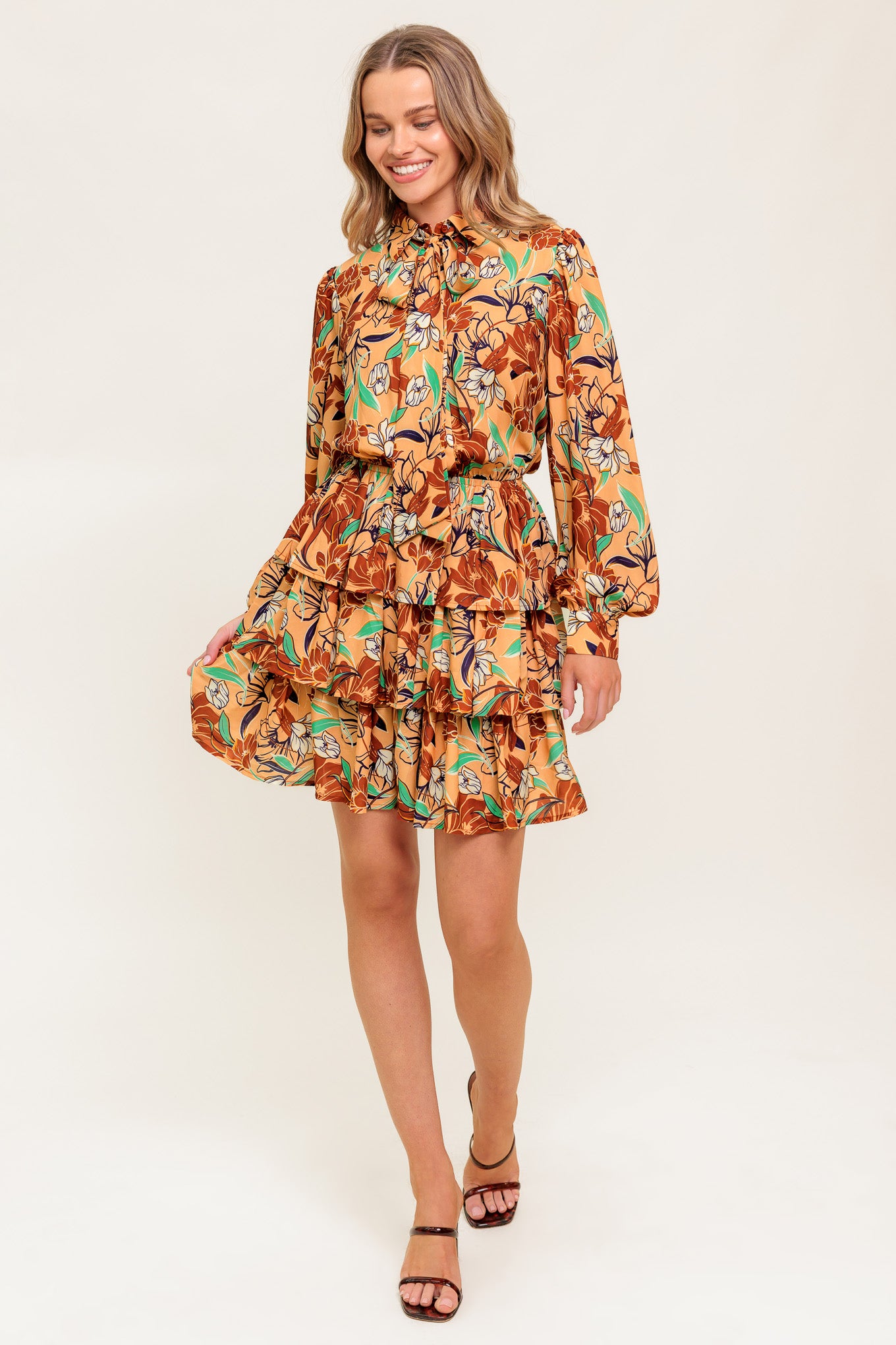 A printed woven mini dress featuring shirt collar, bow tie, buttun down, long sleeve, elasticized waist and layered skirt
Details:
Self : 100% Polyester
Lining : 100% Polyester
Size & Fit
- Model is 5`9" And Wearing Size Small
- Measurements Taken From Size Small
- Approx. Length: 36"