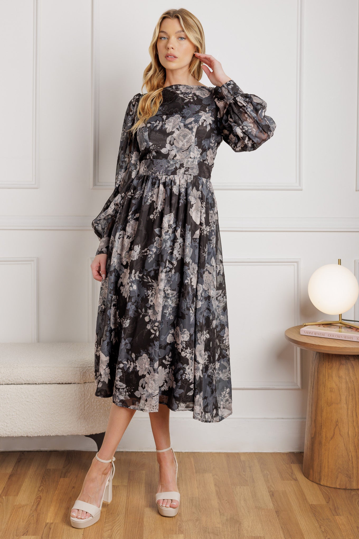 A printed woven midi dress featuring wide neckline, long sleeve with cuff and back zipper closure