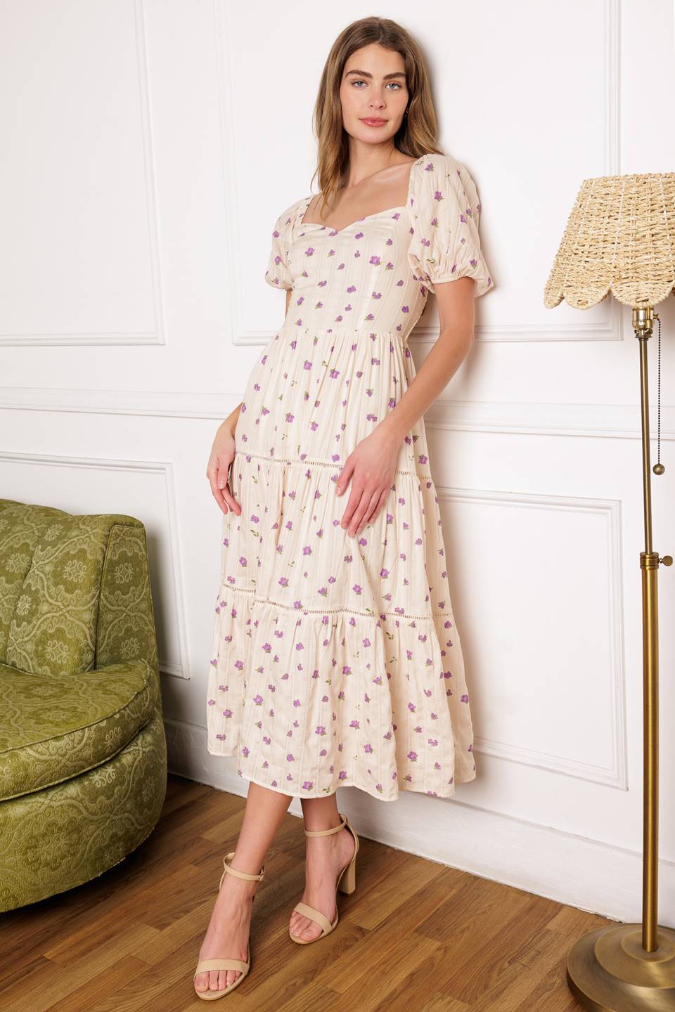 A printed textured woven midi dress featuring sweetheart neckline, short puff sleeve, tiered skirt with ladder lace trim inset and smocked back bodice