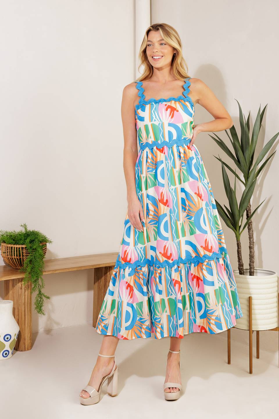 A printed woven midi dress featuring a straight neckline, ric rac ribbon strap/trim, ruffled hemline ,and back zipper closure
Details:
Self: 100% Polyester 
Lining: 100% Polyester
Size & Fit
- Model is 5`10" And Wearing Size Small
- Measurements Taken From Size Small
- Approx. Length: 52"