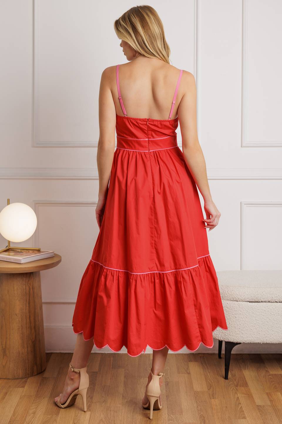 A solid woven midi dress featuring a scalloped straight neckline, shoulder strap, ruffled hemline, and back zipper closure from Flying Tomato