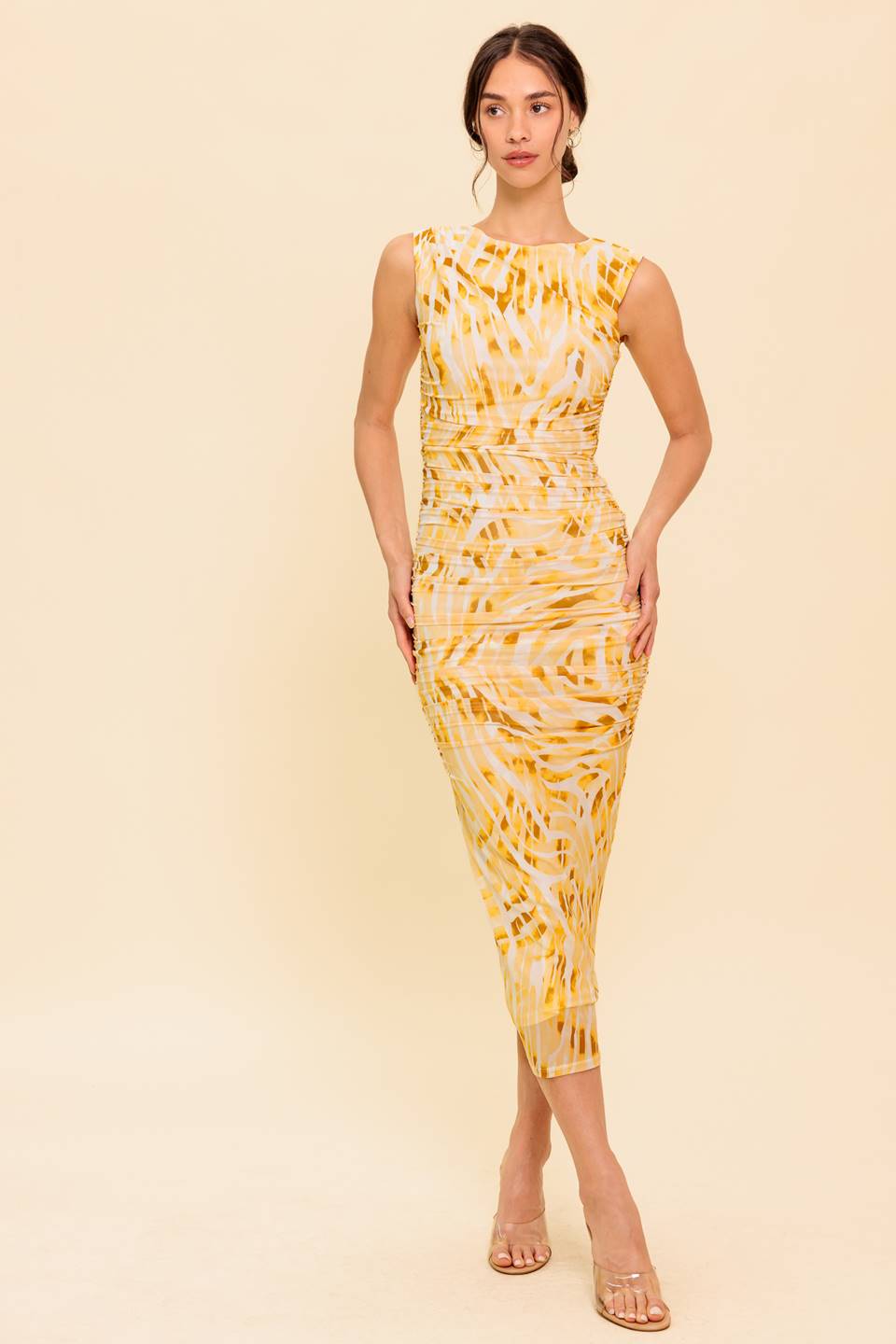 A printed woven maxi dress featuring halter neckline with tie, waist yoke and smocked back waistband