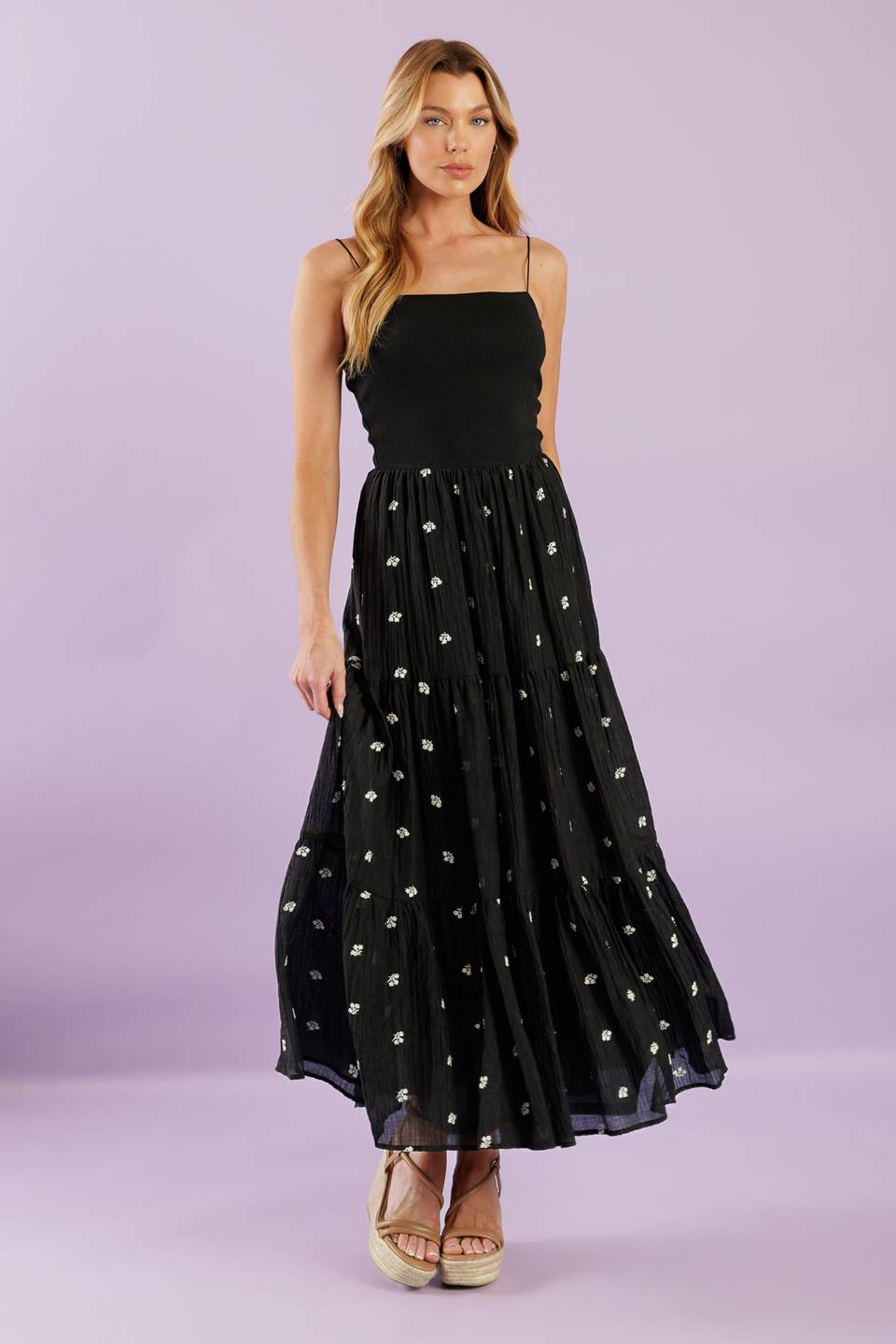 A knit and woven combination midi dress featuring knit top with straight neckline with straps, elasticized waist,  embroidered woven skirt with ruffled hemline
