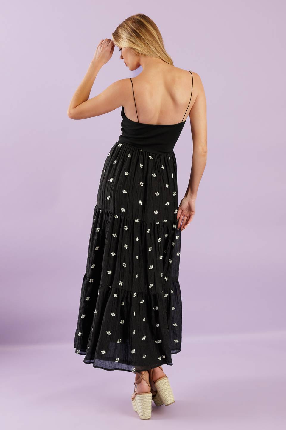 A knit and woven combination midi dress featuring knit top with straight neckline with straps, elasticized waist,  embroidered woven skirt with ruffled hemline