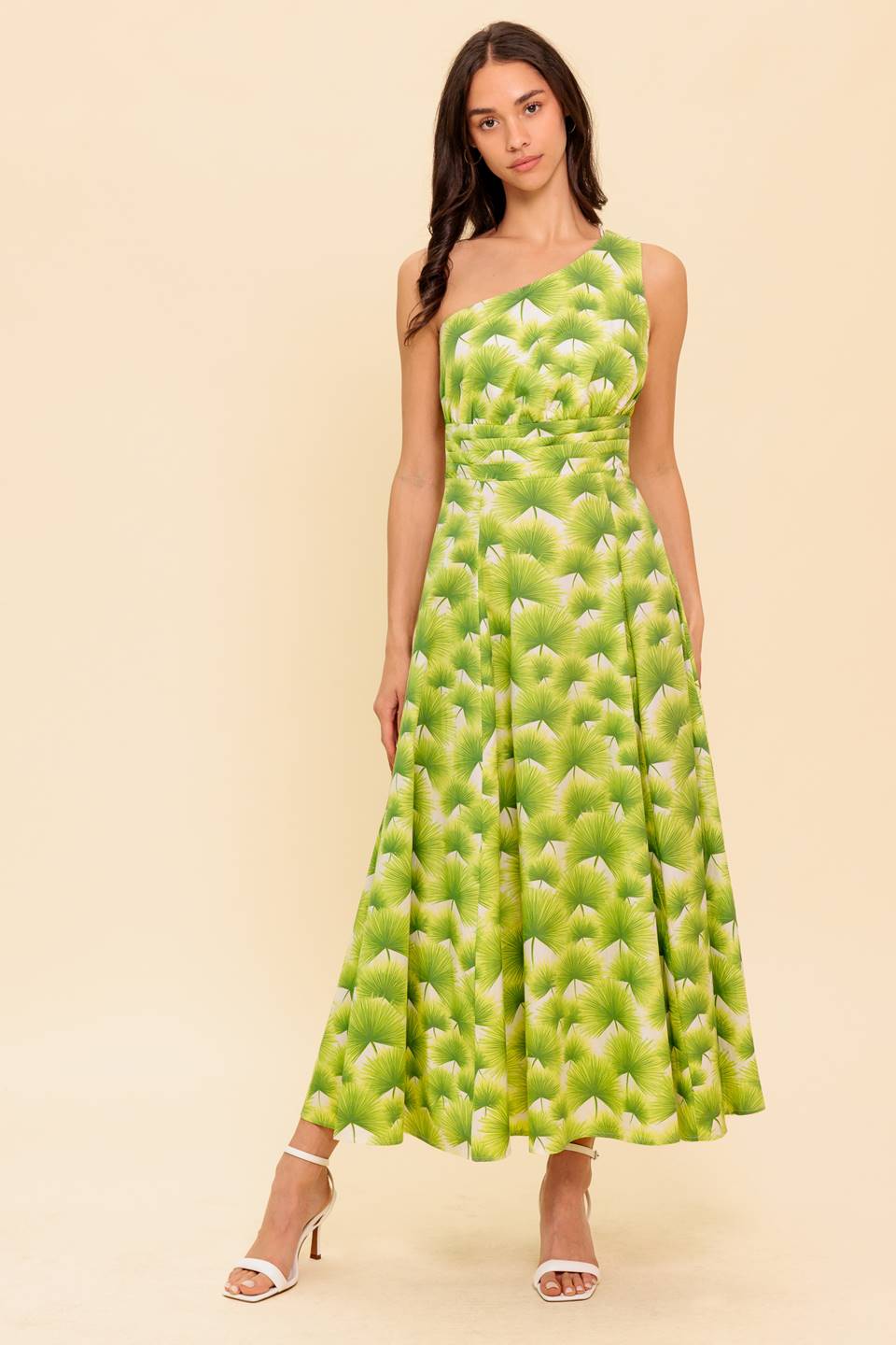 A printed woven midi dress featuring one shoulder neckline, shirred waistband, full skirt and side zipper closure