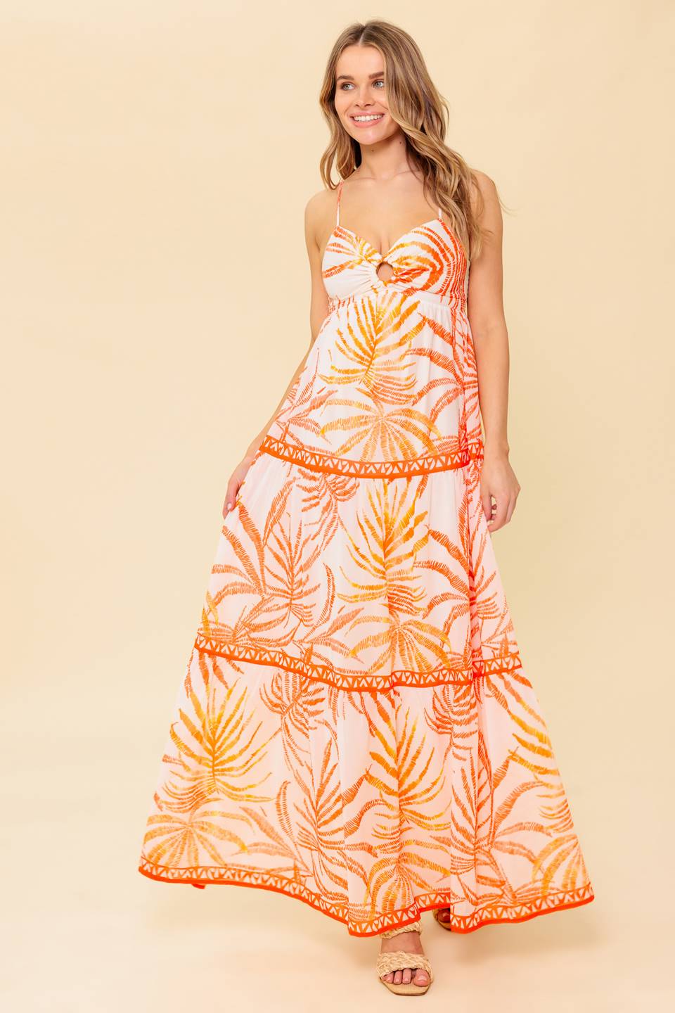 A printed woven maxi dress featuring cami bodice with O ring detail, tiered skirt and smocked back bodice