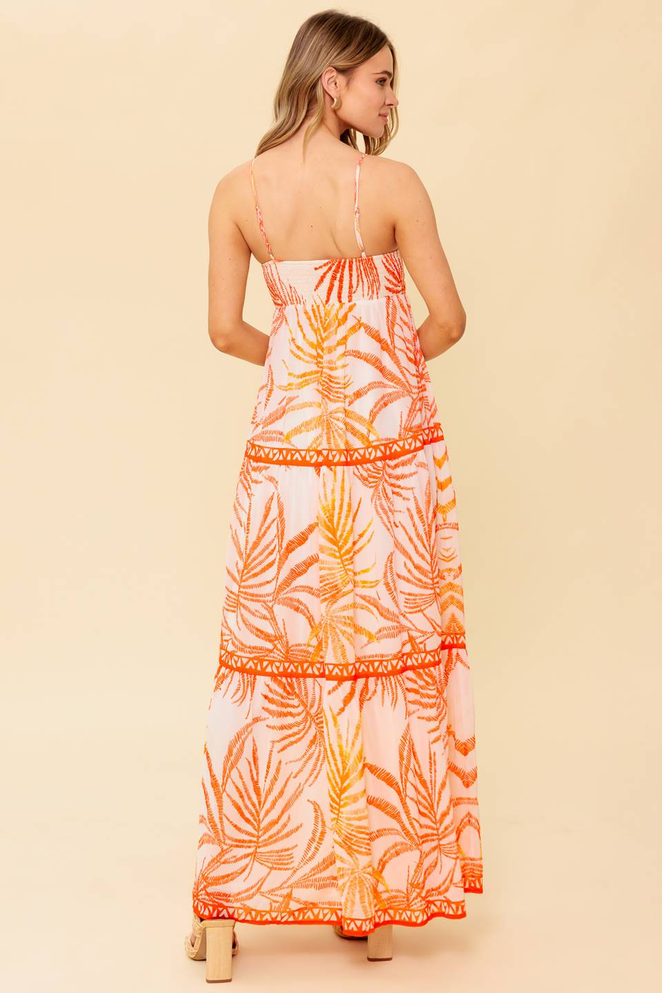 A printed woven maxi dress featuring cami bodice with O ring detail, tiered skirt and smocked back bodice