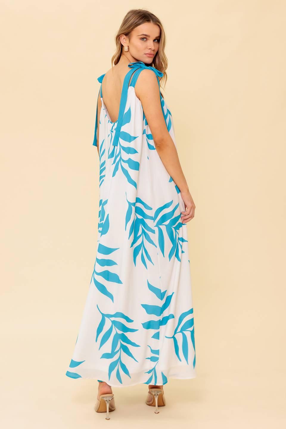 A printed woven maxi dress featuring straight neckline, shoulder tie and plunging back