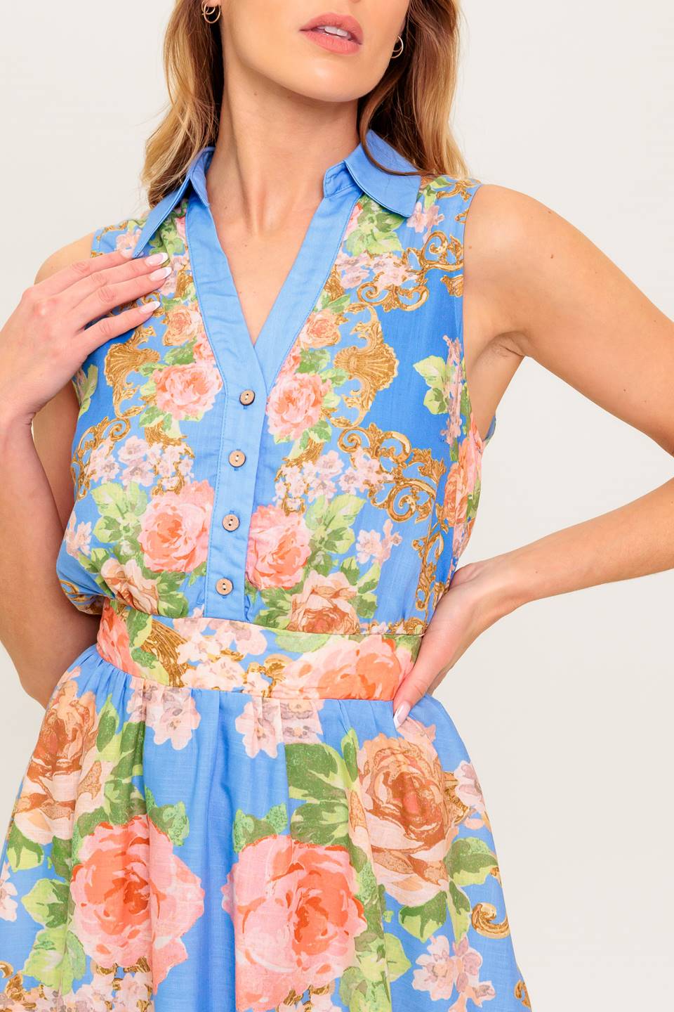 A printed woven midi dress featuring collar, V neckline, button down, sleeveless, full skirt and smocked back waistband