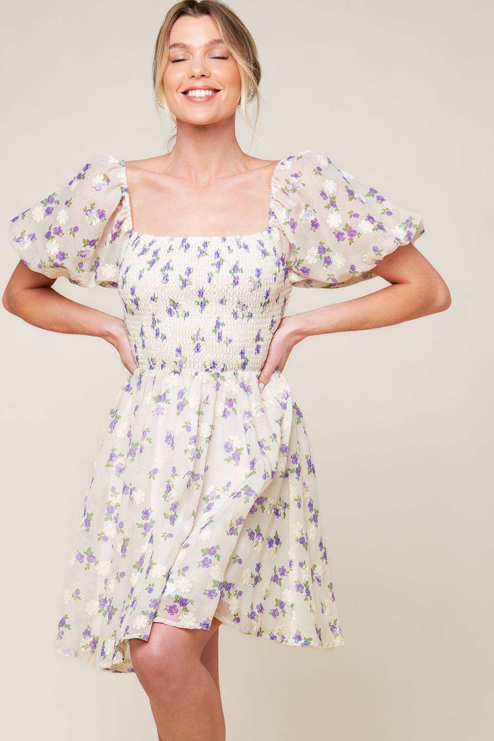 A floral texture printed woven mini dress featuring square neckline, short puff sleeve and full skirt.