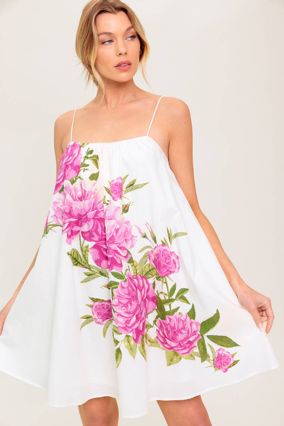 A white and pink floral printed woven mini dress featuring straight neckline and skinny shoulder straps