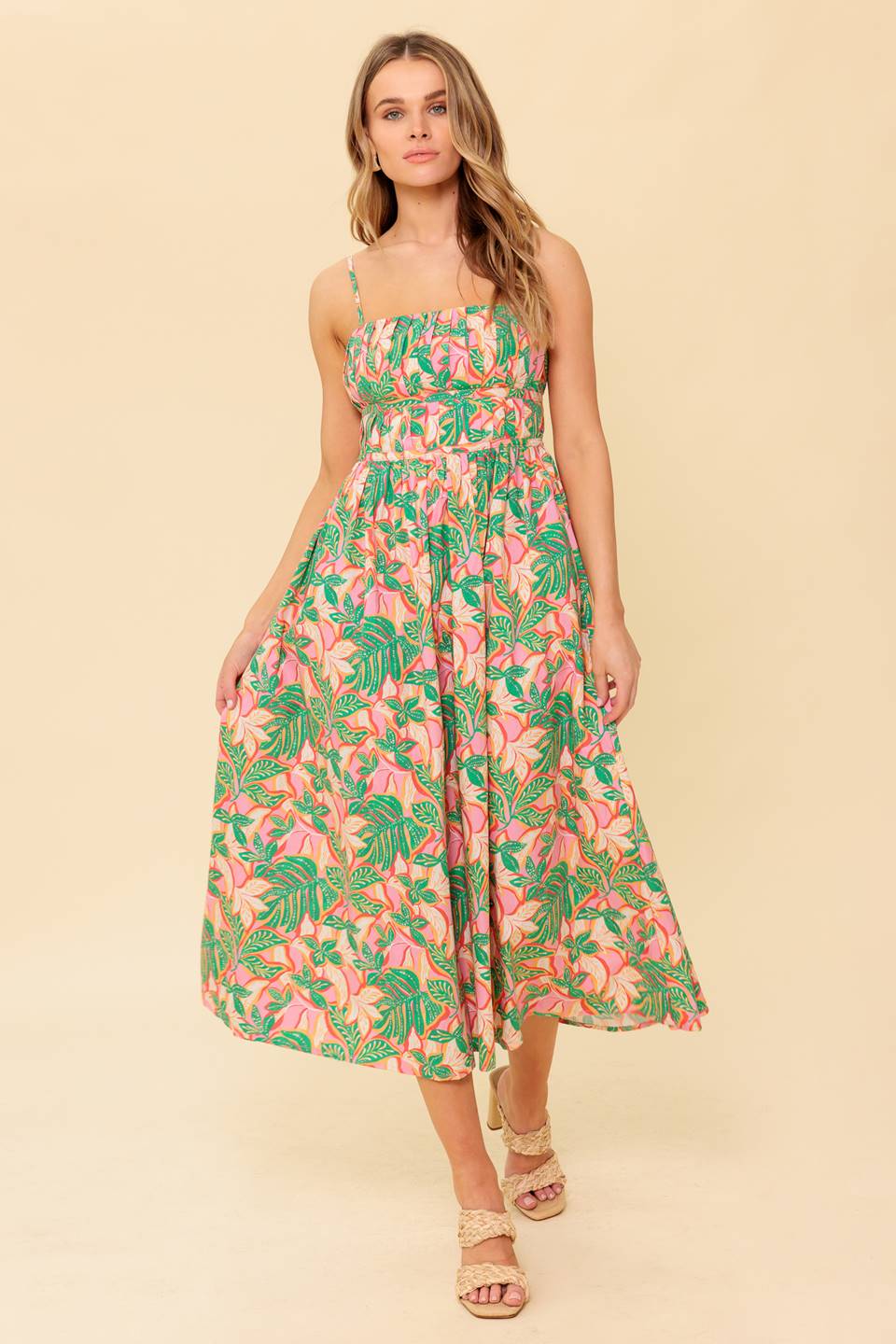 A printed woven midi dress featuring pleated bodice, straight neckline with shoulder strap, full skirt and back zipper closure