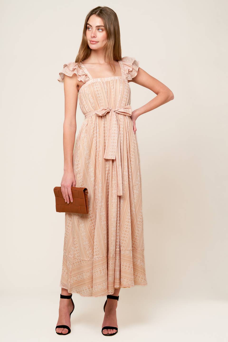 A textured woven midi dress featuring square neckline, double ruffed sleeve and self sash tie
Details:
Self : 100% Cotton
Lining : 100% Polyester
Size & Fit
- Model is 5`8" And Wearing Size Small
- Measurements Taken From Size Small
- Approx. Length: 55"