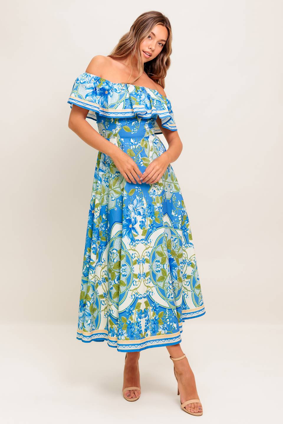 A printed woven midi dress featuring off shoulder neckline with flounce, circle skirt and back zipper closure