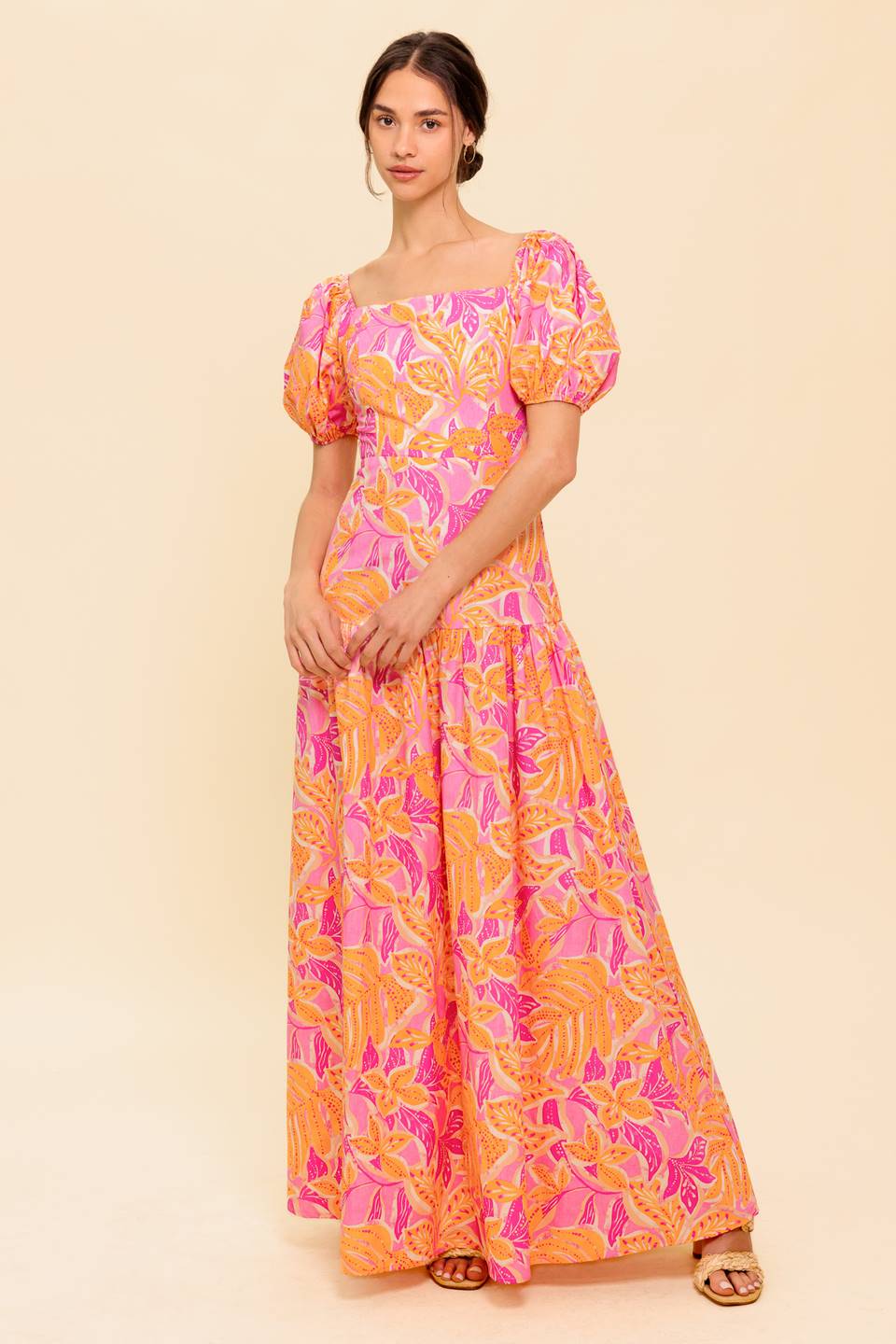 A printed woven midi dress featuring square neckline, short puff sleeve and smocked back bodice with zipper closure