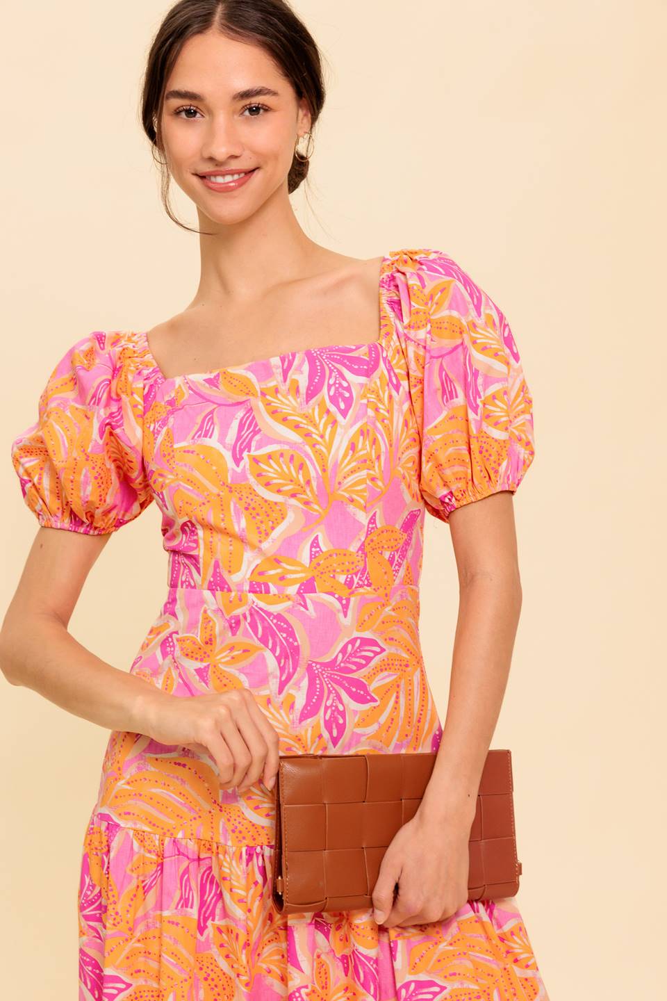 A printed woven midi dress featuring square neckline, short puff sleeve and smocked back bodice with zipper closure