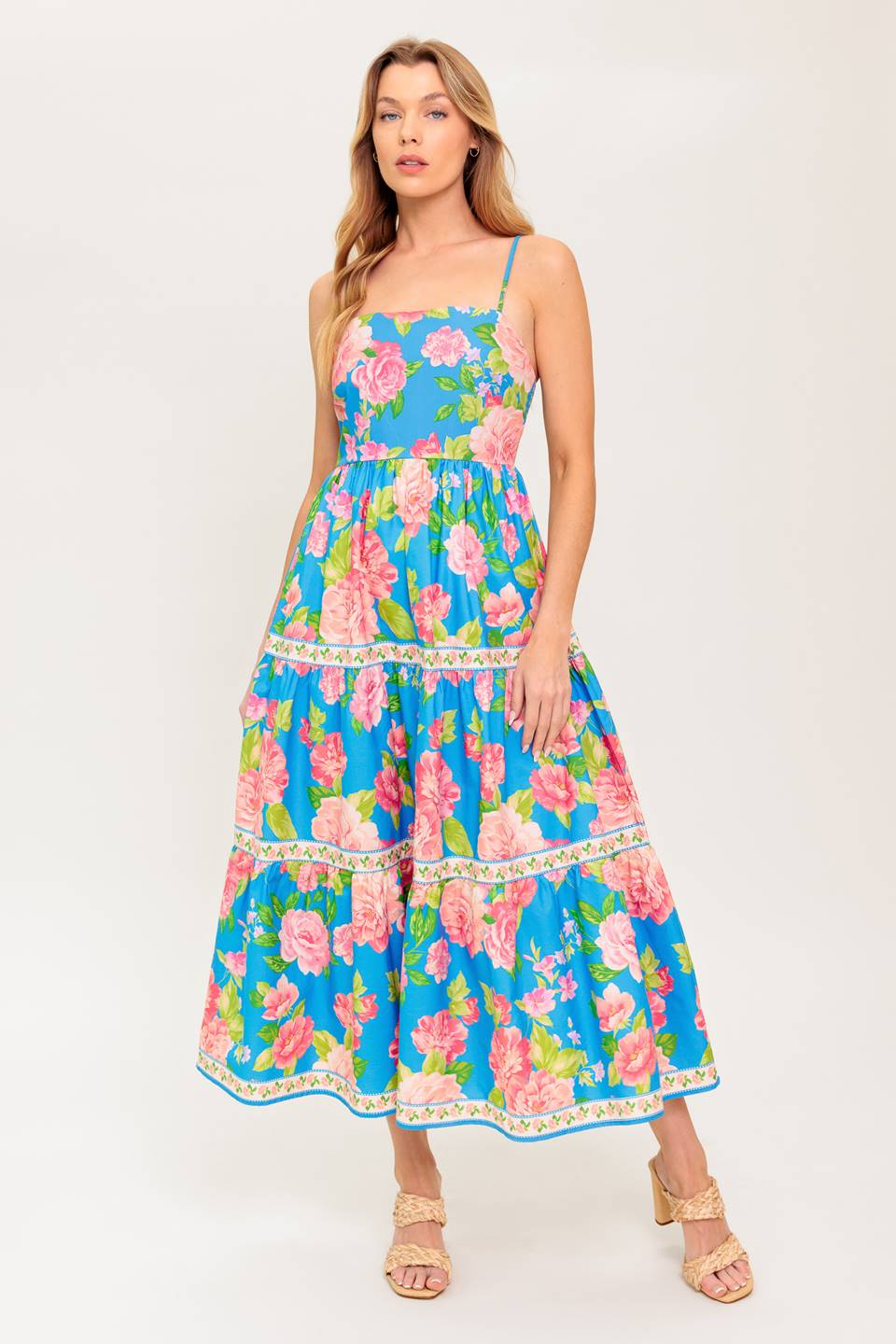 A printed woven midi dress featuring straight neckline, straps, tiered skirt and smocked back bodice
