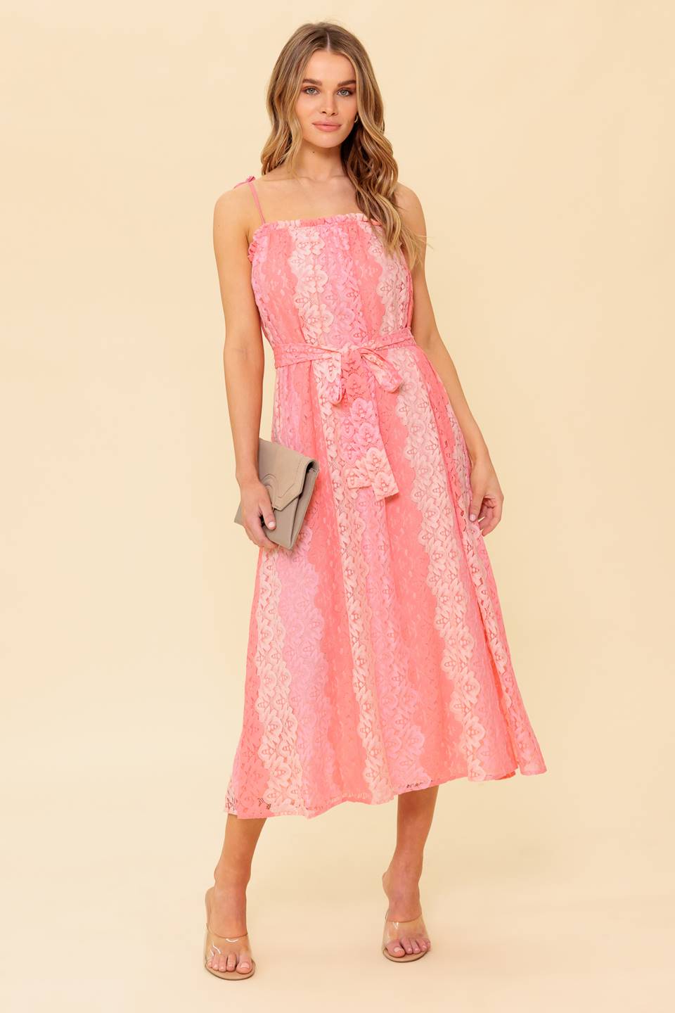A printed woven lace midi dress featuring straight neckline with ruffled edge, straps and self sash tie