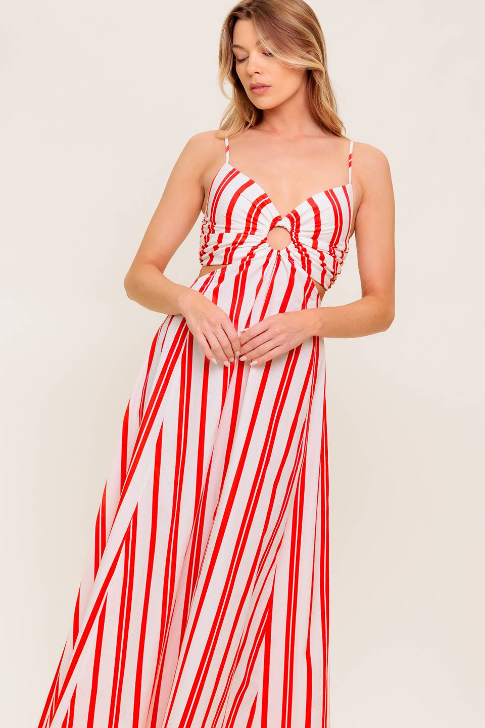 A striped woven ankle dress featuring cami top with center O ring, wide skirt and smocked back bodice.