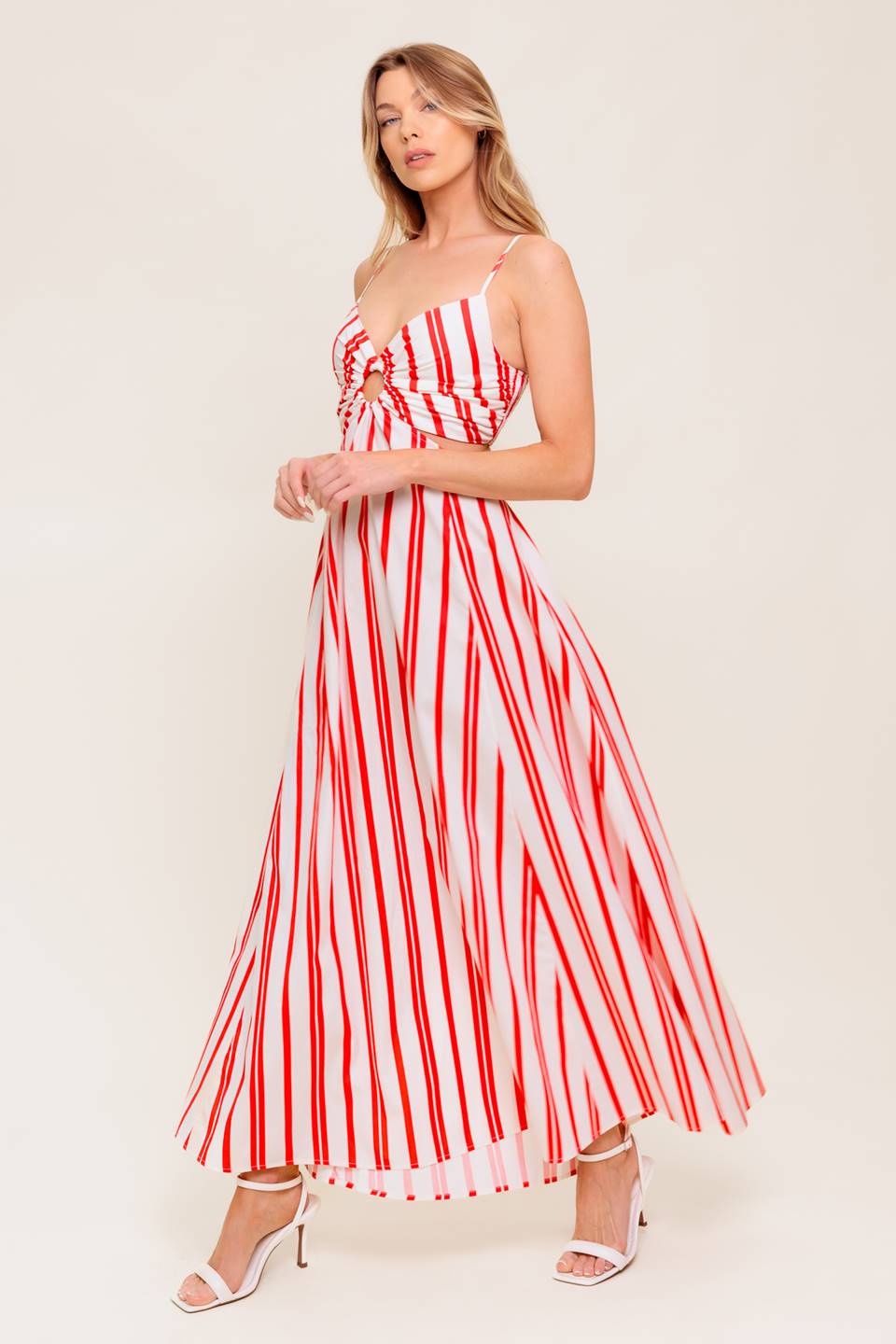 A striped woven ankle dress featuring cami top with center O ring, wide skirt and smocked back bodice.