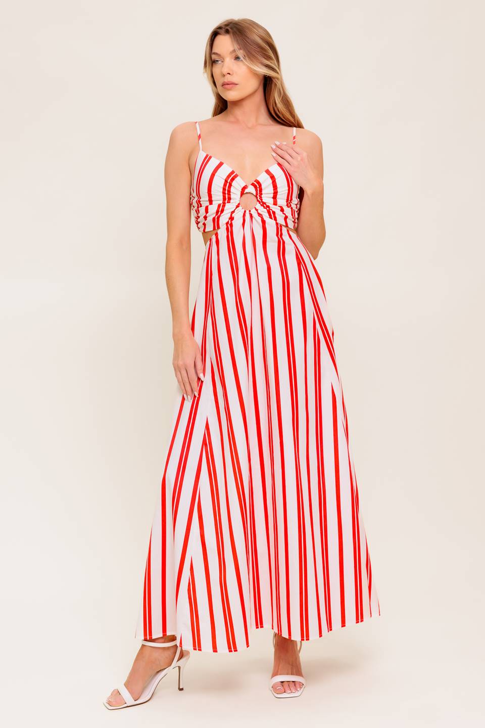A striped woven ankle dress featuring cami top with center O ring, wide skirt and smocked back bodice.