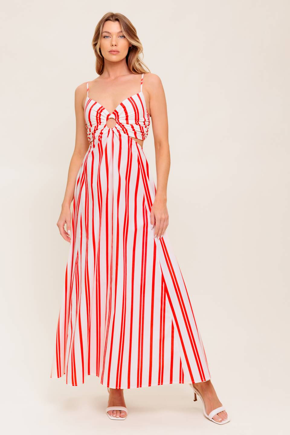 A striped woven ankle dress featuring cami top with center O ring, wide skirt and smocked back bodice.